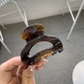 Detail of dark brown tortoiseshell hair claw clip with strong spring and glossy finish - Glossy Light Tortoise