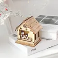 Lighted wooden Christmas cabin ornament with snowman design and LED interior glow - Open House - Snowman