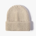 Thick ribbed knit beanie in beige color for winter warmth featuring a cuffed brim design - Beige