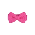 Detailed view of a handmade pink grosgrain ribbon bow hair clip with textured fabric - Rose Red