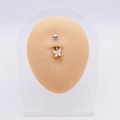Detailed view of silver butterfly belly ring with sparkling crystals on a beige model - White Butterfly I