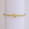 18k gold-plated brass Taurus zodiac bead bracelet with elastic cord on display - Taurus