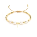Detail of adjustable gold bead bracelet featuring baroque pearls and minimalist pendant - Letter I