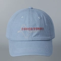Close-up of red Opportunity letter embroidery on washed cotton blue baseball cap - Blue