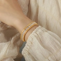 Pulsera de cadena de hueso de dragón dorada con circonitas y bordes de patrón de trigo - Dorado