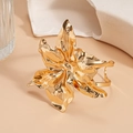 Detailed macro shot of a shiny gold double-layer floral cuff bracelet with wrinkled petals - Bracelet - Gold Flower