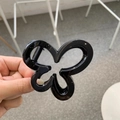 Glossy black butterfly-shaped hair claw clip with a sleek floral design for women - Glossy Black