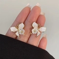 Detailed view of gold butterfly earrings with pearlescent wings and white flower center - 22# Gold Pink Butterfly Shell Texture Earrings