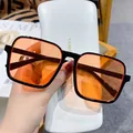 Fashionable square black frame sunglasses with orange lenses and a white leather case - Black Frame Orange Lens