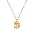 Macro detail of the 18k gold plated letter D pendant and fine link chain necklace - Letter D