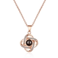 Rose gold spiral heart projection necklace featuring a black central stone and zircon stones - Rose Gold Clover Necklace