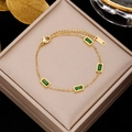 Elegant gold titanium steel bracelet with emerald green zircon stones and lobster clasp - Gold with Four Rectangular Emerald Zirconia