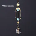 Clear Quartz suncatcher with gold metal moon and stars, featuring light blue crystal prisms - White Crystal Moon Wind Chime Pendant