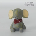 Miniature resin elephant figurine wearing a red polka dot scarf, looking upwards 4.5cm - Elephant with Red Scarf