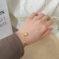 Elegant 18K gold-plated heart pendant bracelet on wrist with minimalist design - [XKB0009] Heart Bracelet Gold