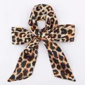 Brown and black leopard print skinny scarf tied in a bow on a white background - S78-Brown Classic Leopard