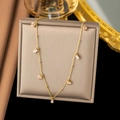 Detail of gold necklace with pink round and rectangular gemstones on a soft cushion - [XLH184] Pink Zirconia Necklace Gold