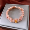 Macro view of French style bracelet with square cut pink and yellow gemstones - Rose Gold Multi-color