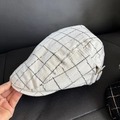 Detail of linen blend flat cap featuring black plaid pattern and side metal buckle - M (56-58cm) / White