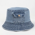 Detailed macro view of denim bucket hat featuring vintage pocket and metal button - M (56-58cm) / Light Blue
