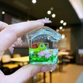 Macro detail of house-shaped liquid quicksand case with turtle and flower for AirPods - Green Turtle [Little House]