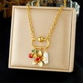 18K gold-plated necklace with cherry, flower, and pearl charms on a beige jewelry box - Cherry Flower Pearl Style (N3705)