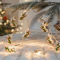 Warm white LED Christmas string lights with red and green wooden sock pendants - Christmas Sock