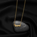 Gold Taurus zodiac necklace featuring an artistic script pendant on a fine cross chain - Taurus Gold