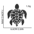 Detailed view of turtle embroidery patch with precise dimensions 7.6cm by 6.6cm - Black & White