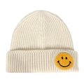 Cream white knitted beanie featuring a vibrant yellow smiley face chenille patch detail - One Size / Off White