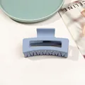 Detailed macro view of large matte Morandi blue claw clip with hollow geometric design - 8.5cm Rectangular - Matte Mist Blue