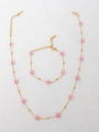 Detail view of gold stainless steel necklace with pink flower beads and lobster clasp - Light Pink Necklace And Bracelet