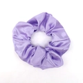 Elegant lavender satin scrunchie with a glossy silk-like finish and soft pleated texture - Purple