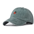 Detailed close-up of dark green washed cotton baseball cap with red strawberry embroidery - Dark Green
