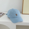 Close-up of light blue denim baseball cap with detailed brown bear embroidery on the front - 50-52cm (2-5 Years) / Light Blue
