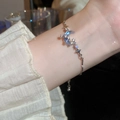 Close-up of silver adjustable moon and star bracelet with blue gradient stones - S391 Silver