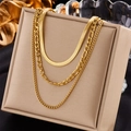 Elegant multi-layered gold titanium steel chain necklace set on a beige display stand - Gold