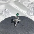 Detailed shot of silver snake ring with green teardrop gem and realistic scale texture - Style 9 Adjustable Ring