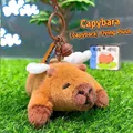 Portachiavi capibara di peluche marrone con ali bianche e campanellino marrone - Peluche Volante con Ali