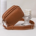 Brown litchi leather crossbody camera bag with wide fabric strap and silver zippers - Brown