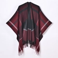 Detail of red and black plaid woven shawl featuring tassel fringe and V-shaped hem - Black Red Plaid With Tassels