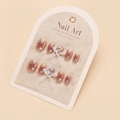 Detail of handmade press-on nails with white mesh bows and crystal gems on a display card - By1728 / Glue Type