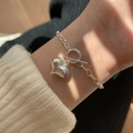 Close-up of a silver bead chain bracelet with a heart pendant and T-bar toggle clasp - OT Toggle Heart Bracelet