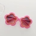 Pink flower-shaped kids sunglasses with orange accents and gradient purple lenses - Pink