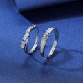 Adjustable silver couple rings set with zircon stars on an elegant blue surface - Star and Moon Zirconia Style (QL-002)