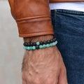 Men's distance bracelet set with black lava stone and green cracked beads on wrist - Green Weathered + Lava