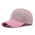 Pink baseball cap for women featuring delicate floral embroidery and solid canvas brim - Adjustable / Pink