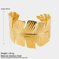 Detailed view of a 40mm wide gold palm leaf stainless steel cuff bracelet with intricate texture - Greek Style Leaf Style (A1109) / Gold