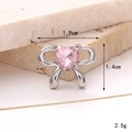 Detailed view of pink bow-shaped silver charm with dimensions 1.9cm width and 1.4cm height - Heart Gem Bow Pink
