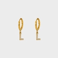 Detail of gold letter L earring with micro-paved zircons and polished mirror finish - L